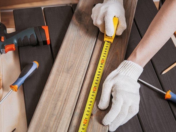 A professional using measure tool and tools